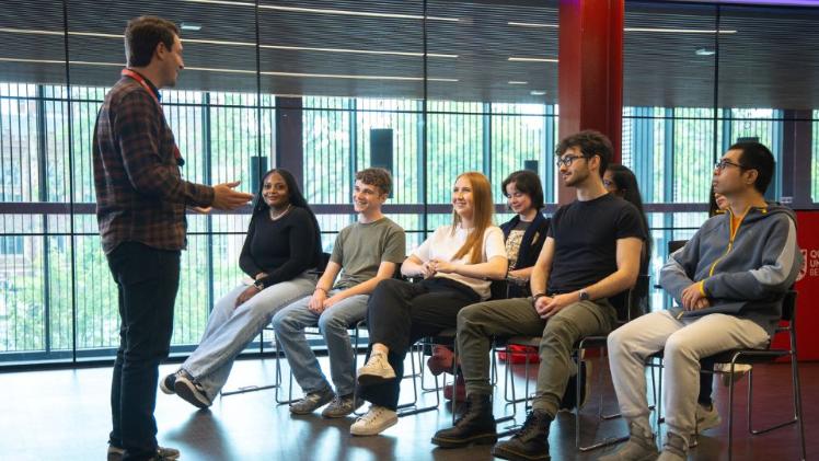 students sitting in a room being given a talk